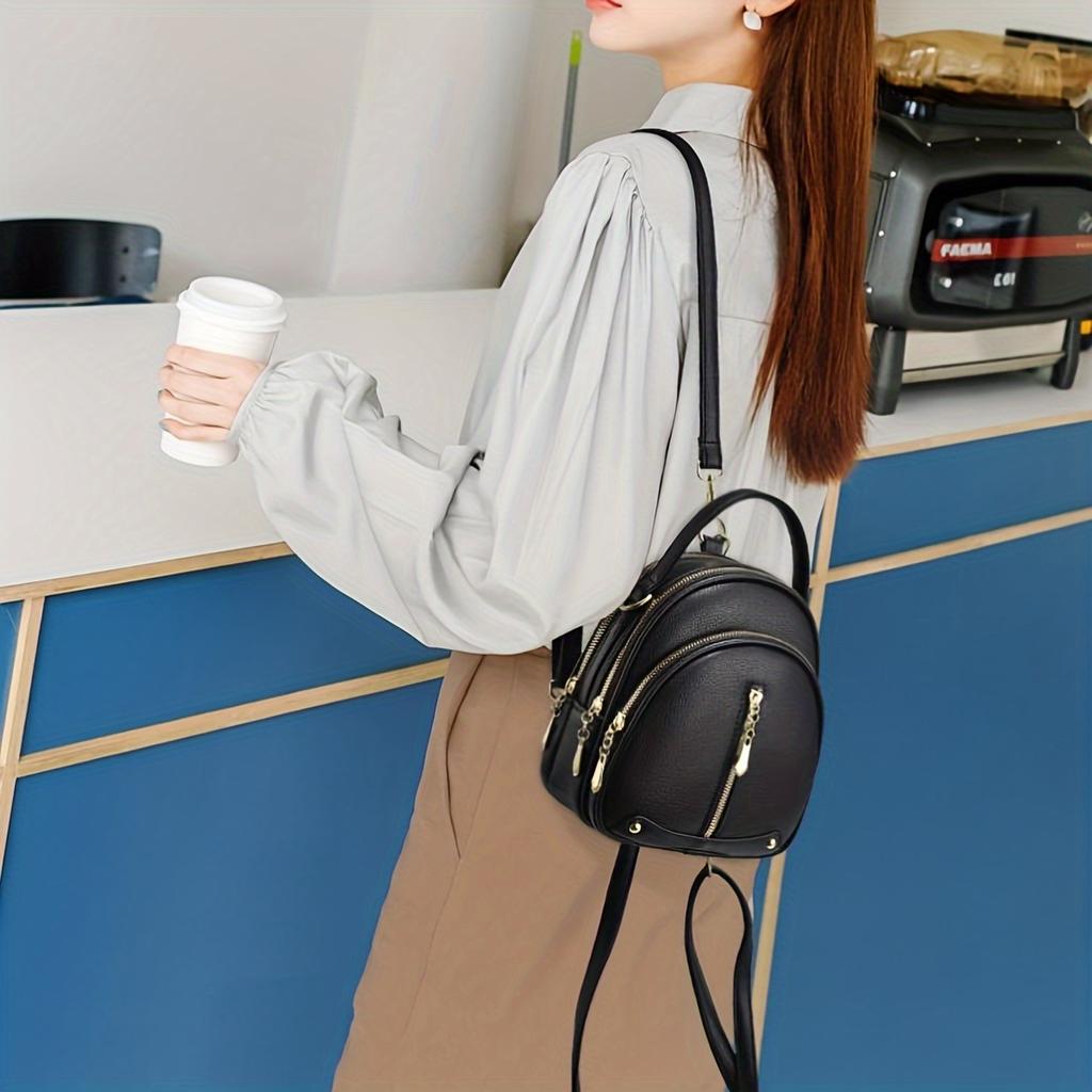 Damen PU kleiner Rucksack für den täglichen Pendelverkehr. Schlichtes und elegantes Design. Verwendet eine einfarbige Farbe mit mehreren Reißverschlüssen. Kann von Hand getragen werden.