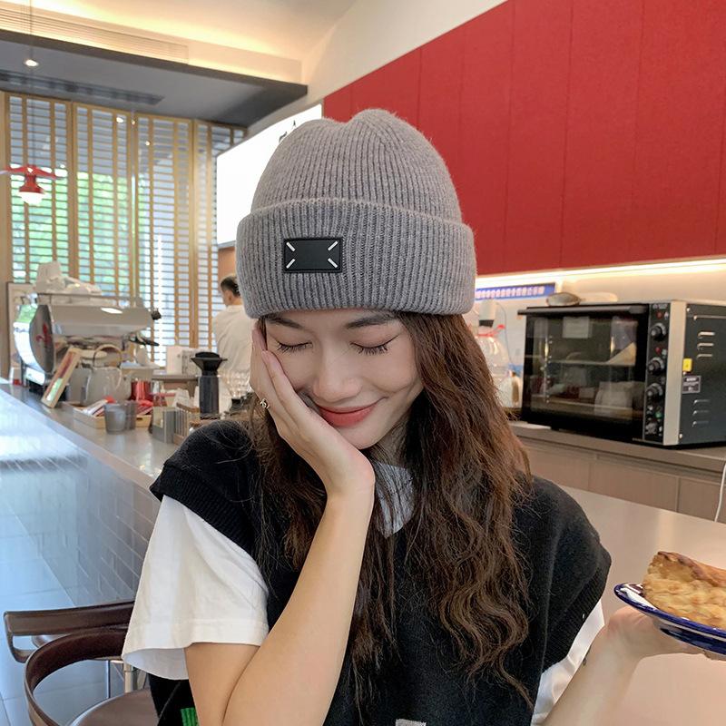 Winter new thick wool knitted hat warm versatile bag head hat flanged ear protection fashion wool hat women's cold hat