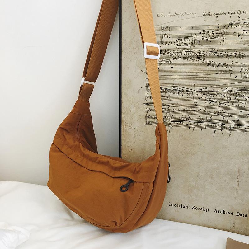 Casual crossbody bag girls lightweight shoulder canvas bag waterproof commuting solid color versatile nylon dumpling bag for men
