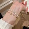 Elegant French Retro Heart Tassel Diamond Pendant Bracelet - High-End Fashion for Women.