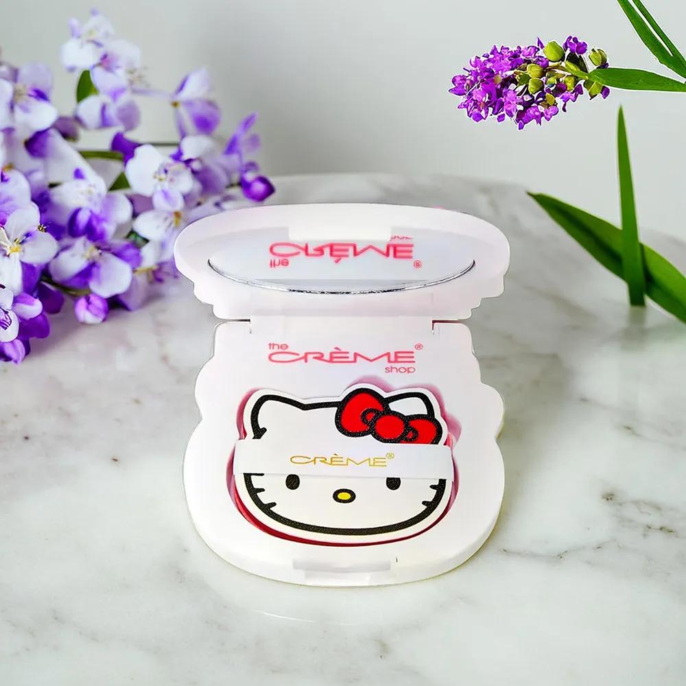 THE CREAM SHOP Зеркальце-пудреница Hello Kitty с красной ленточкой, 100 листов пергаментной бумаги