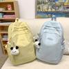 Simple Solid Color Letter Embroidery Student Backpack With Plush Pendant For Middle School Students