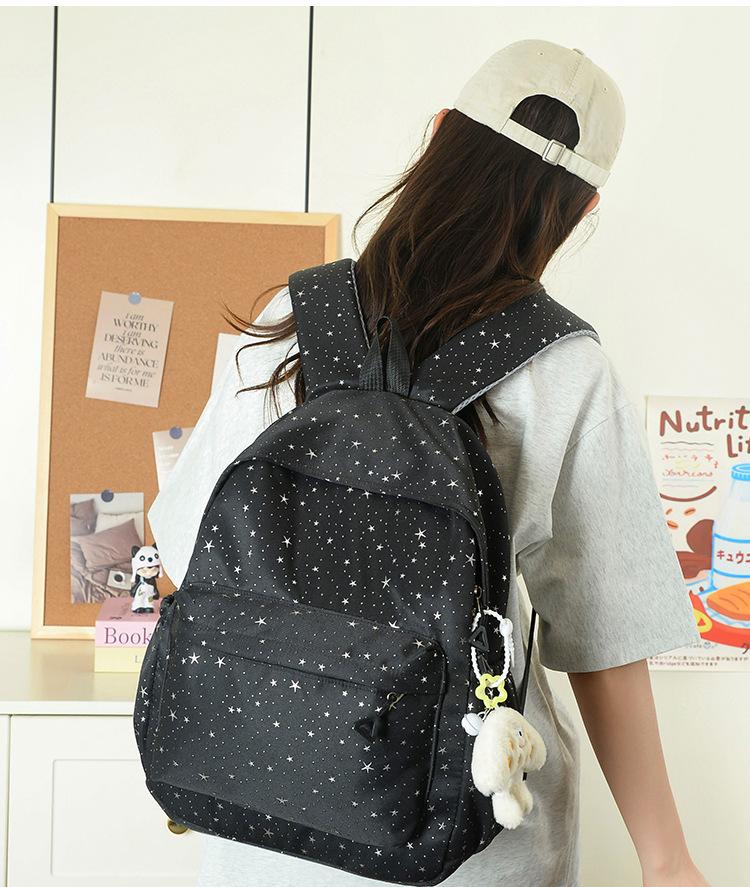 Schoolbag design sense star sequined schoolbag female small fresh solid color primary school student backpack large capacity high school backpack