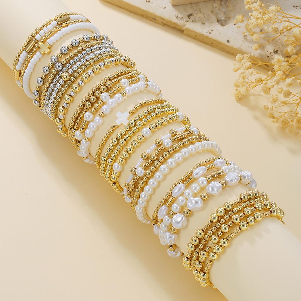 European and American jewelry niche design cross bracelet set sweet cool beaded stacked shell pearl bracelet