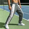 Pantalon de jogging bicolore à séchage rapide pour homme - Coupe ample, taille à cordon de serrage, style sportif décontracté.