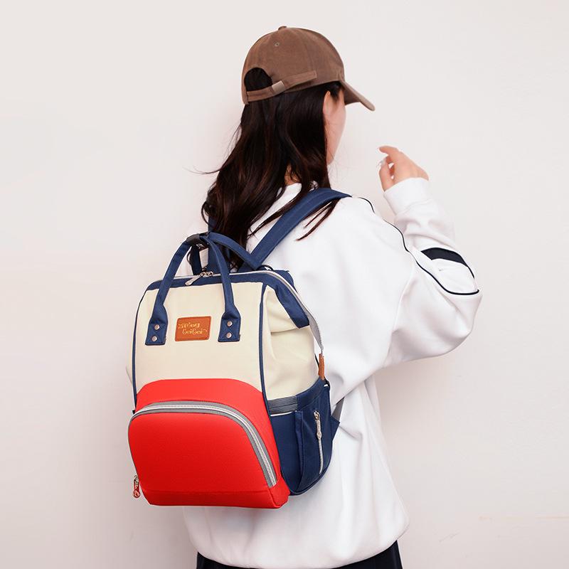 2025 Korean Style Mommy Backpack: Multifunctional Fashion Canvas Color Block Bag with Baby Bottle Holder