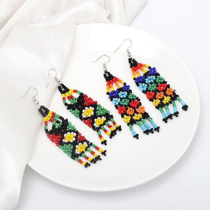 European and American ethnic style handmade rice bead fringed earrings, niche design sense vintage retro earrings