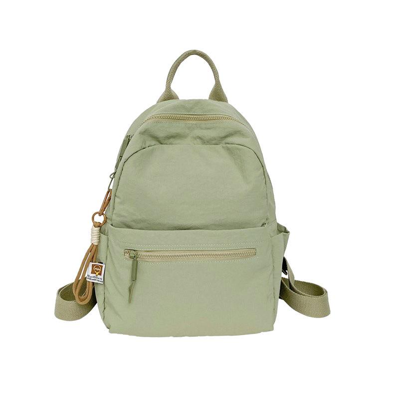 

New solid color simple texture backpack large capacity schoolbag women s fresh retro storage bag Korean version popular mother and baby bag зелёный