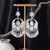 Bohemian Ethnic Miao Silver Tassel Earrings with Butterfly, Peacock, and Flower Design for Women – Long Dangle Jewelry for Travel Photos.