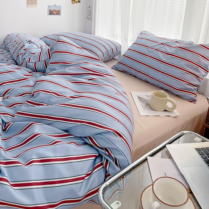 Simple Red And Blue Striped Duvet Cover And Four Piece Bed Sheet Set With Washed Cotton Bedding On The Bed
