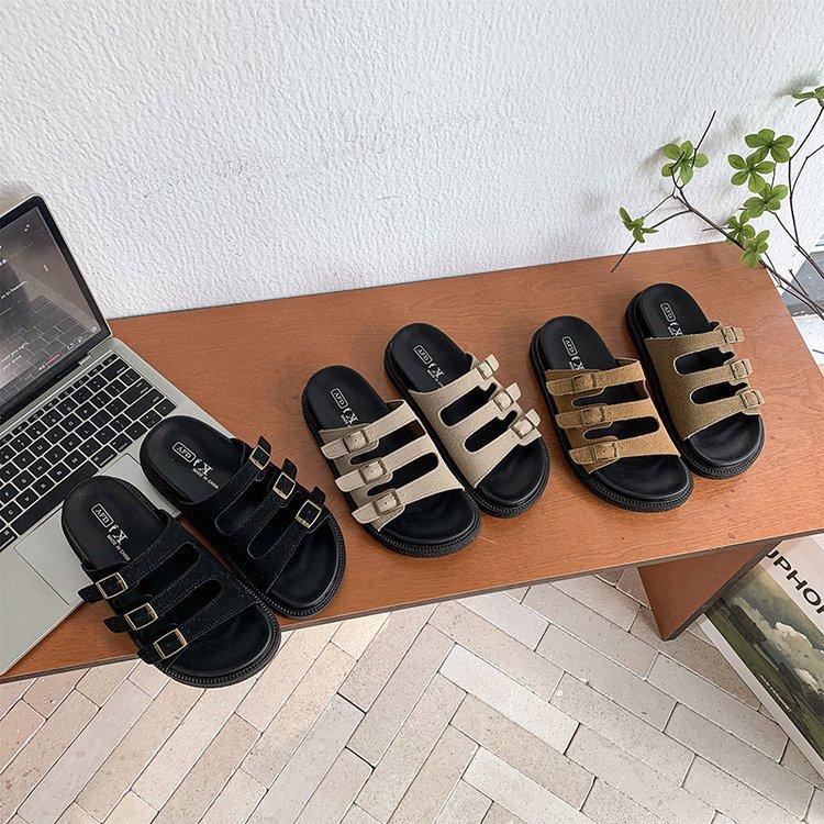 Korean version of casual one-word buckle holiday slippers for women's summer wear 2025 new thick-bottomed cork beach cool slippers