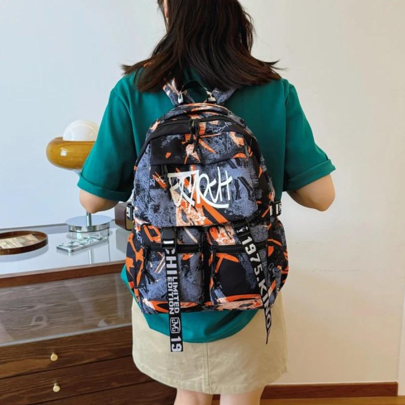 Přizpůsobený pánský nylonový graffiti batoh Velkokapacitní Všestranná verze Korejský cestovní batoh na krátké vzdálenosti pro počítač
