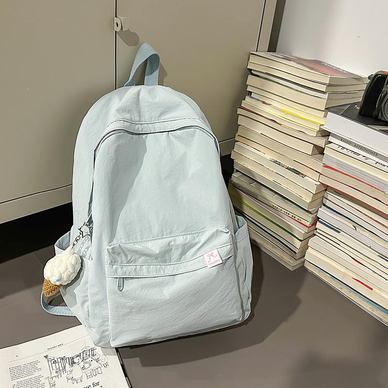 Japanese simple solid color schoolbag female college student casual versatile backpack large capacity junior high school student travel backpack