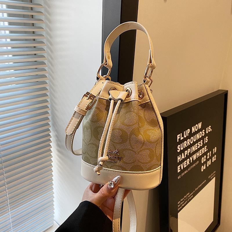 Ms. Baos nye allsidige messengerbag, bærbar bøtteveske.