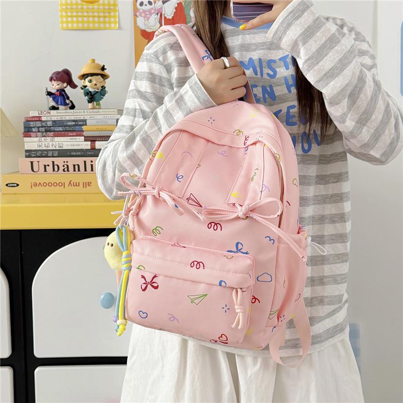 Cute Bow Tie Print School Backpack Lightweight Nylon Zipper Daypack with Front Pocket for Teen Girls Daily Travel