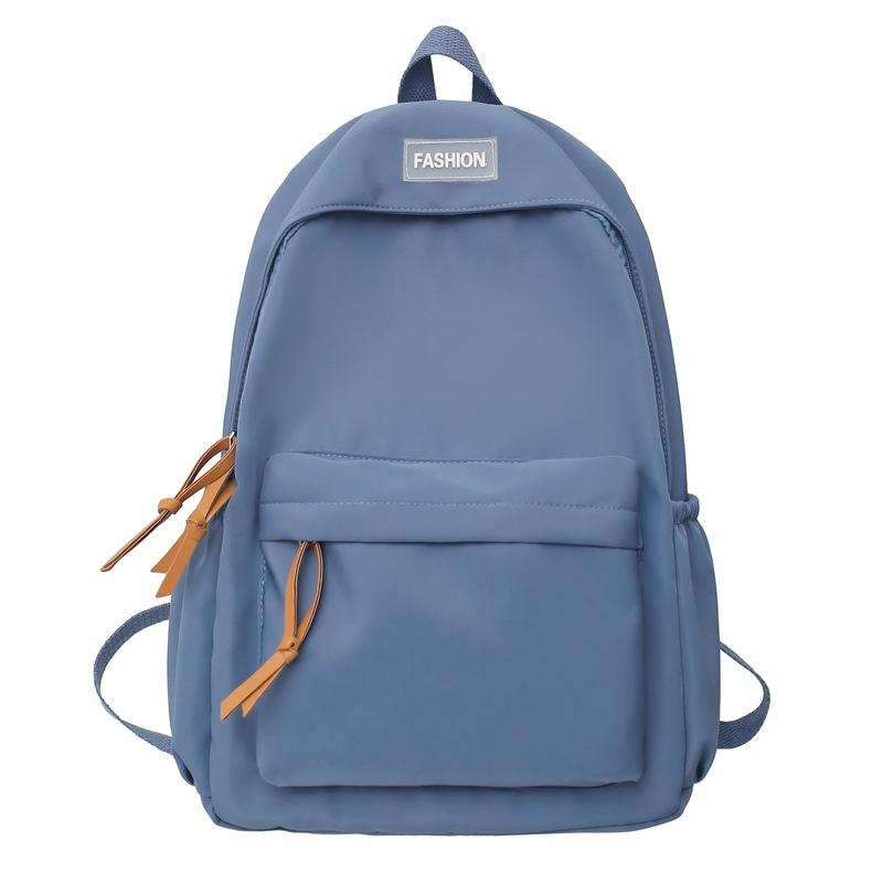 New solid color backpack, junior high school college student schoolbag, leisure travel large-capacity backpack