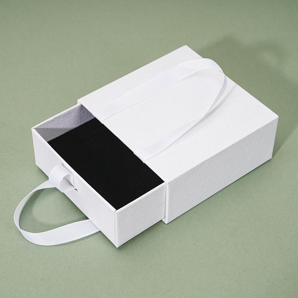 Compact Portable Jewelry Box for Rings, Necklaces, and Ear Studs - Simple Design, Ready for Gift-Giving.