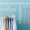 1pc - Nine hole multifunctional magic folding clothes hanger, convenient storage and space saving storage cabinet