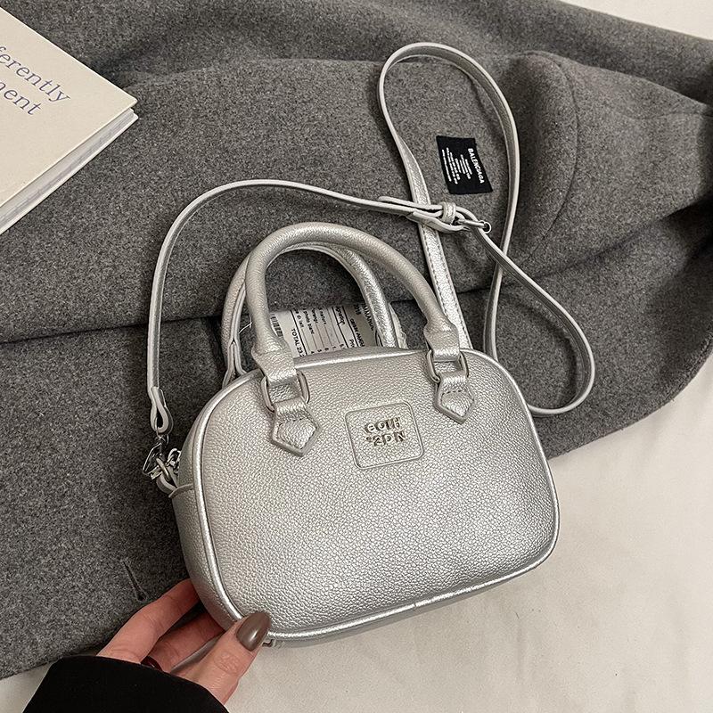 Early Spring Hot Sale French Niche Fashionable Portable Bowling Bag Solid Color Versatile Temperament Advanced Sense Messenger Women's Bag