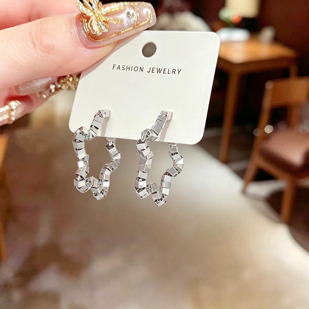 Exquisite Retro Silver Foil Star Earrings - Women's Unique Design