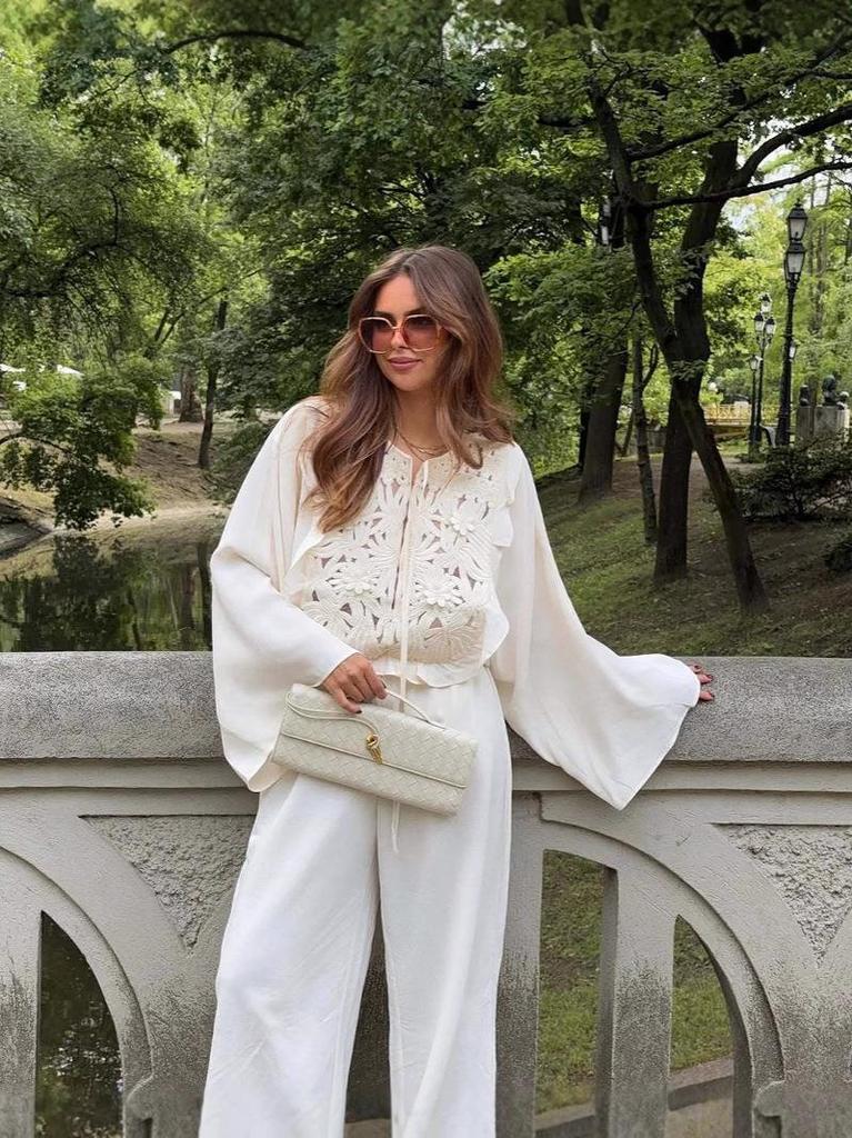 European & American Women's Fashion Tie-Up Cutout Patchwork Two-Piece Set: Round Neck Long Sleeve Top & Mini Skirt for Vacation or Casual Wear.