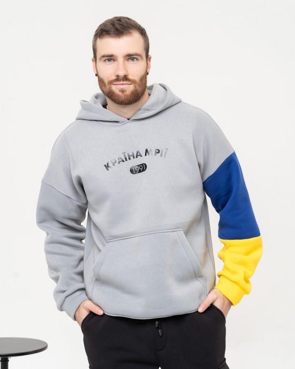 Sweat à capuche avec cordon de serrage et empiècements bleus et jaunes ISSA Plus