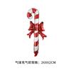 Christmas bows, candy canes, aluminum foil balloons with red and white stripes for a happy Christmas and New Year outfit
