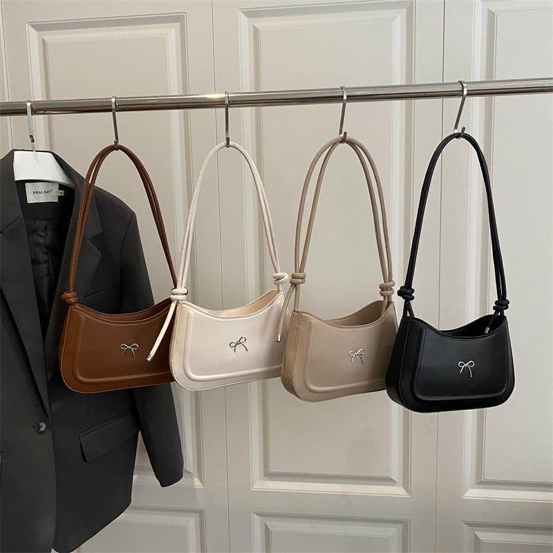 Simple pressure shell autumn temperament bow decorative design texture large capacity casual axillary shoulder women's bag