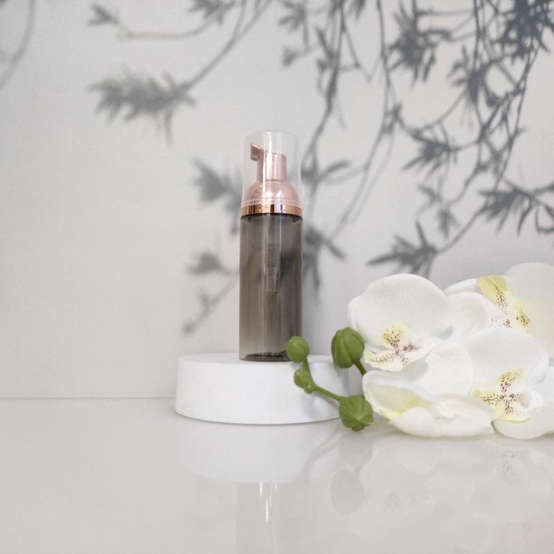 Available 60ml Transparent Black Foam Mousse Bottle for Face Wash and Travel-friendly Cosmetic Packaging.