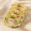 Artistic Ethnic Enamel Four Leaf Clovers Alloy Bracelet Featuring Drip Oil Craftsmanship Symbolizing Luck Love and Hope