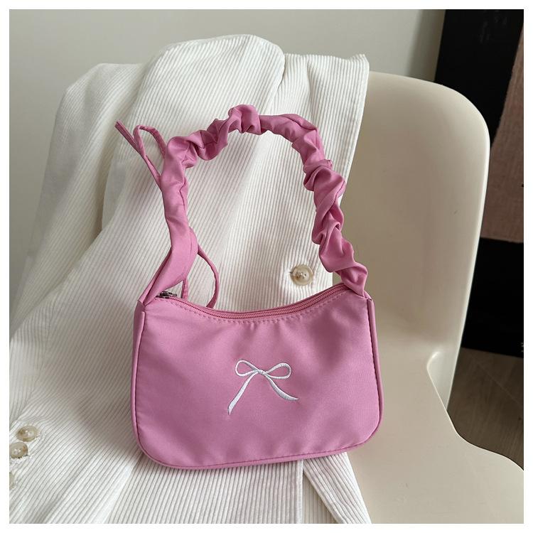 

Новые модные сумки для женщин В этом году Высококлассная модная одноплечевая сумка-подмышка Нишевый дизайн Сумка-тоут