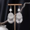 Bohemian Ethnic Miao Silver Tassel Earrings with Butterfly, Peacock, and Flower Design for Women – Long Dangle Jewelry for Travel Photos.