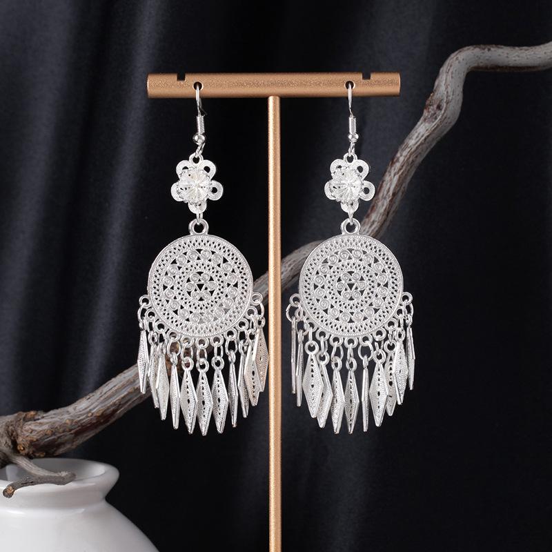 Bohemian Ethnic Miao Silver Tassel Earrings with Butterfly, Peacock, and Flower Design for Women – Long Dangle Jewelry for Travel Photos.