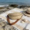 One ladies' straw waist bag with adjustable shoulder strap for crossbody wear, suitable for summer beach vacations and daily use