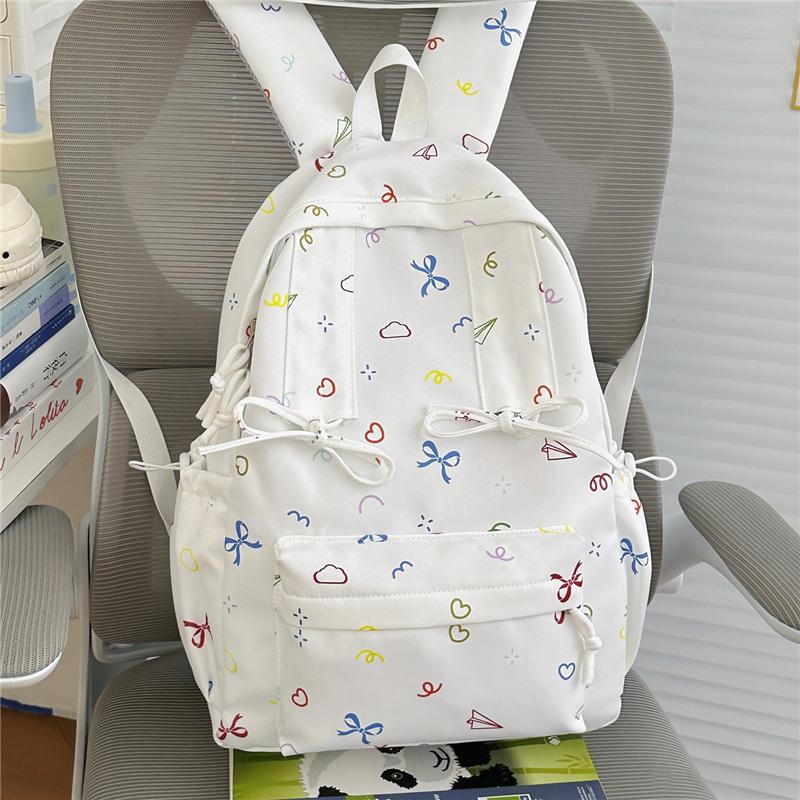 Cute Bow Tie Print School Backpack Lightweight Nylon Zipper Daypack with Front Pocket for Teen Girls Daily Travel