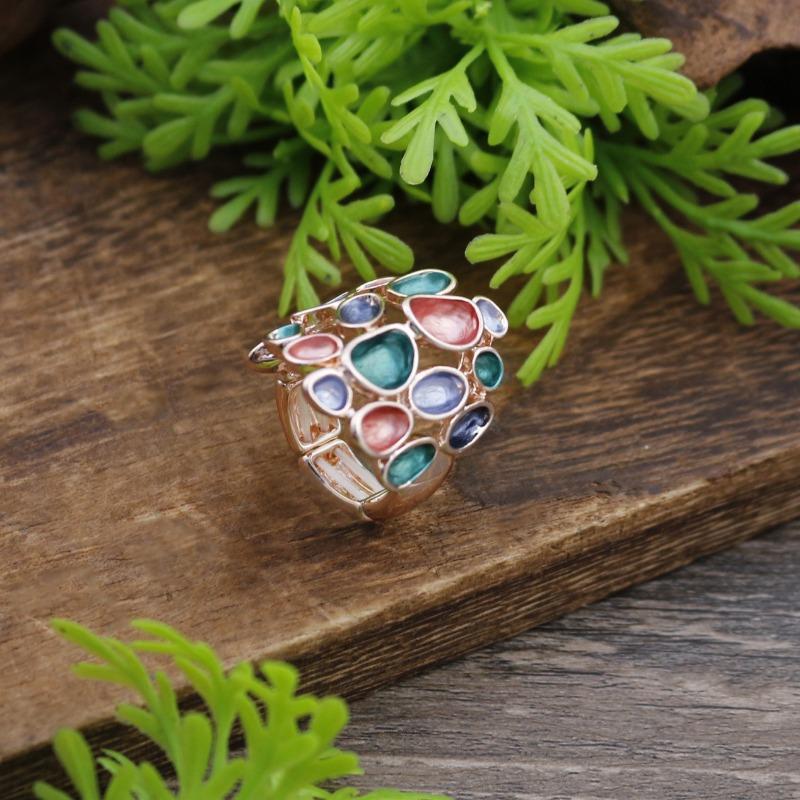 

New enamel color hollow geometric flower elastic ring women s fashion versatile flower cluster high-end ring