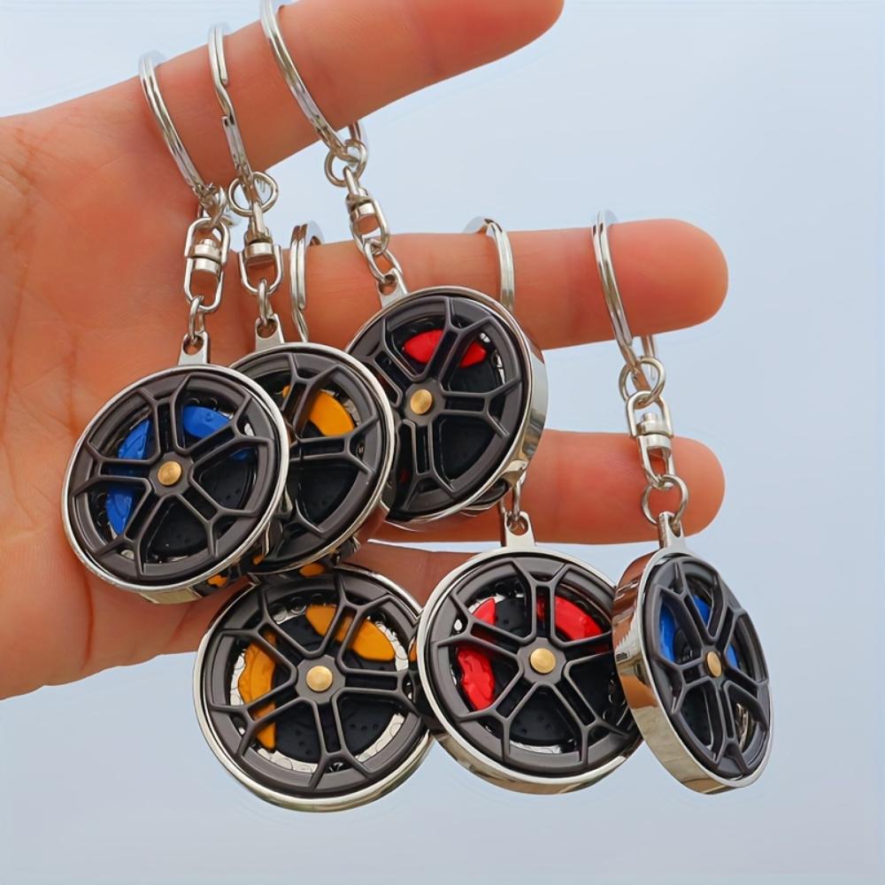 Metallbremsradnabe drehen integrierte Pistole schwarzer Schlüsselanhänger Weihnachtsgeschenk Mercedes-Benz Radnaben-Bremssattel-Schlüsselanhänger