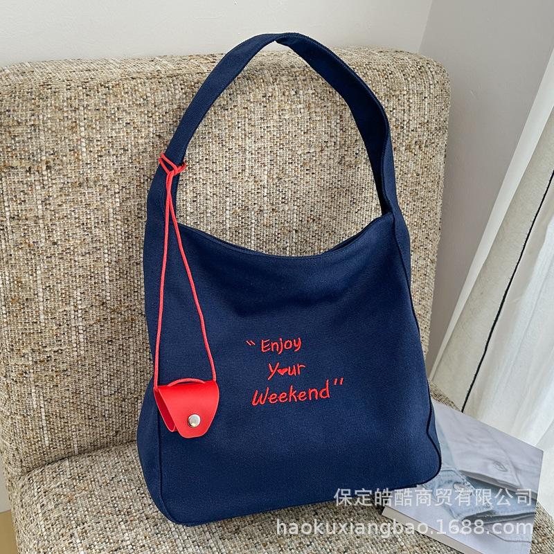 

Literary temperament canvas bag 2025 new trendy women s letter embroidery large capacity shoulder bag lazy style versatile синій
