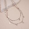 Light Luxury Stainless Steel Starburst Tassel Necklace: High-End Double Layer Clavicle Chain for Women's Fashion