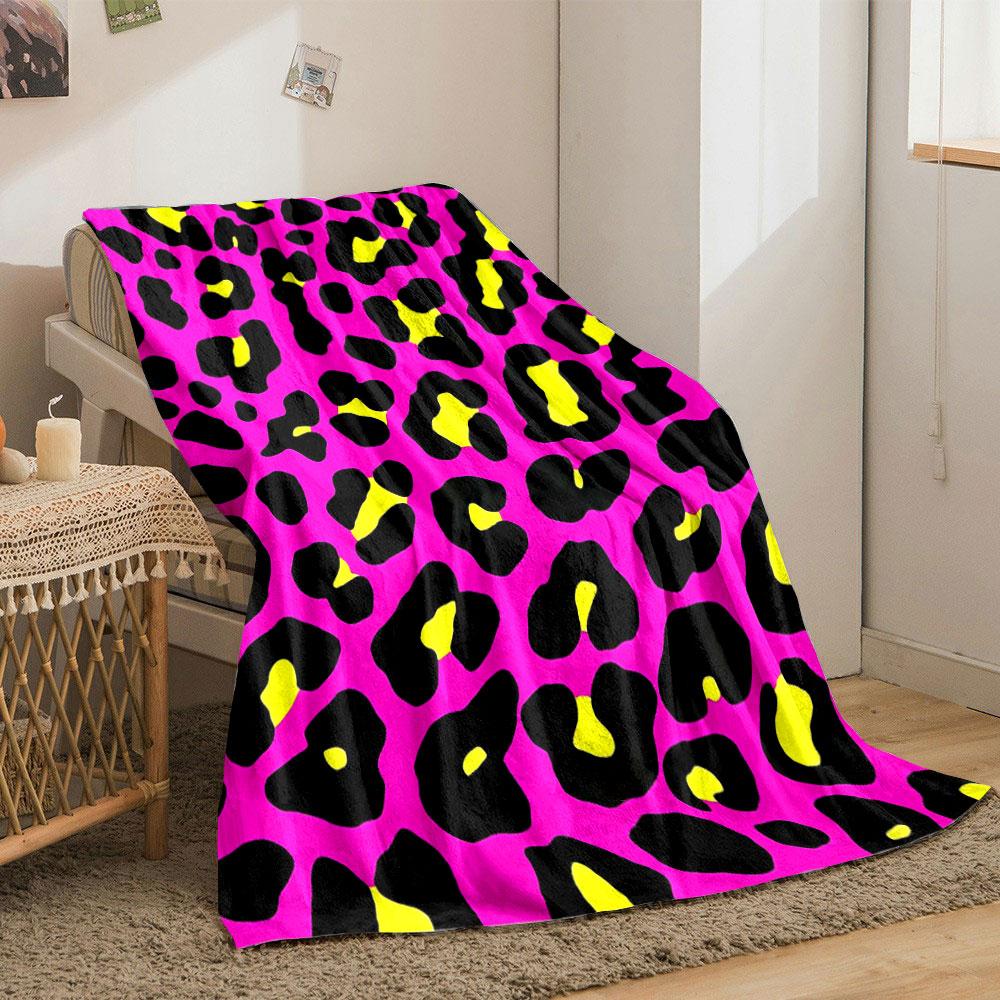 Bold leopard print with black spots, yellow centers, on a pink background. for all seasons blanket lunch break throw gift
