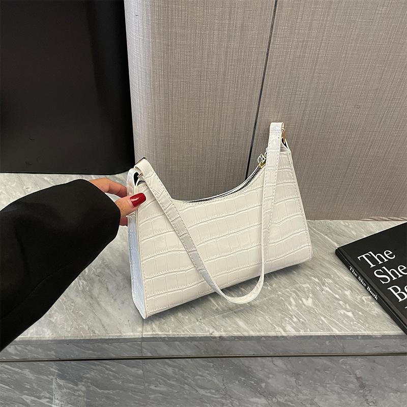 Французская нишевая женская сумка 2026 новая мода однотонная сумка под мышку текстурная портативная плечевая сумка-багет белый