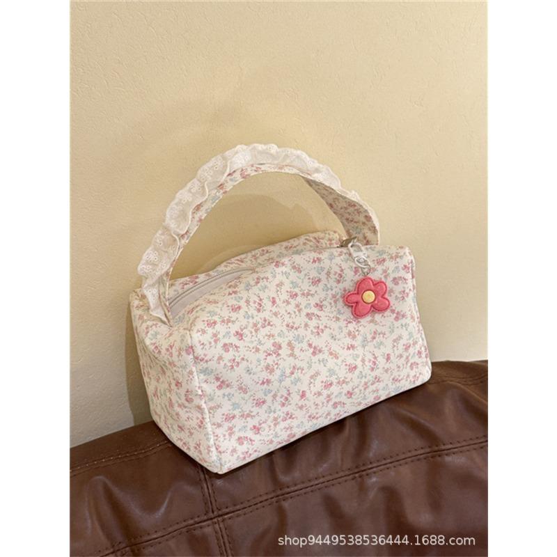 Spring and summer new small floral handbag high value large capacity makeup toilet bag going out three-dimensional storage bag