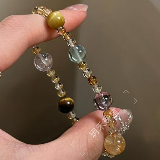 

Elegant Multicolor Crystal Bracelet: Yellow Tower, Purple Crystal, Tiger Eye, and Green Fluorite for Women.