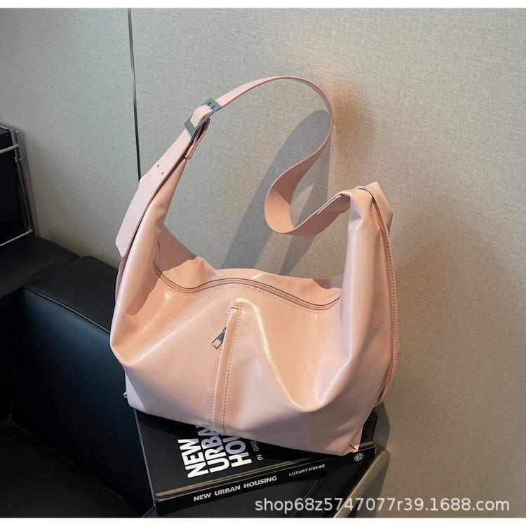 

Simple tote bag commuter high sense large capacity shoulder messenger bag versatile niche design women s armpit bag розовый