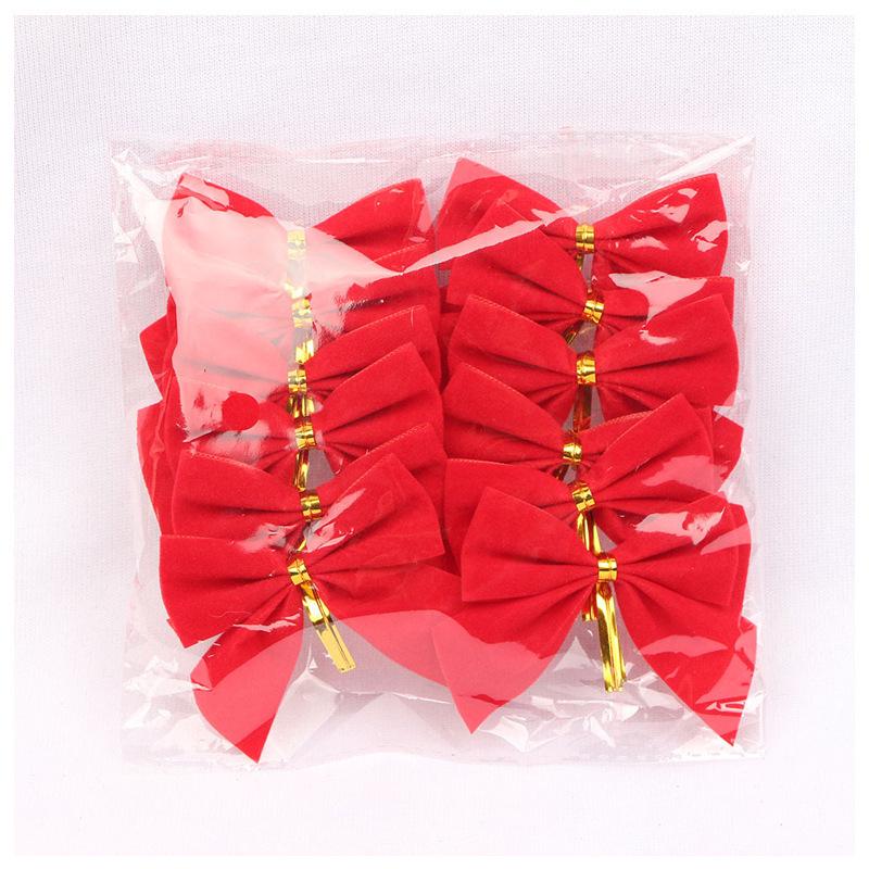 

Christmas Tree Decorations: Gold & Red Flocking Bows and Small Hanging Ornaments
