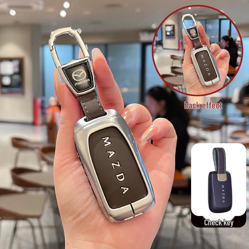 Kuooo: Wear-resistant, fully enclosed Mazda EZ6 key fob and EZ60 car remote protective cases with buckle.