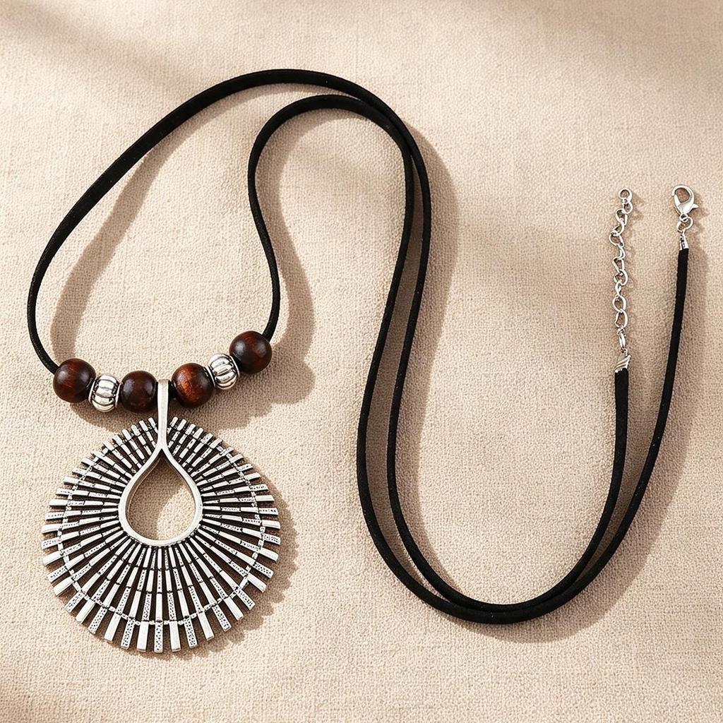 Cross-Ethnic Retro Long Sweater Chain with Black Leather Rope and Tribal Pendant - Women's Necklace