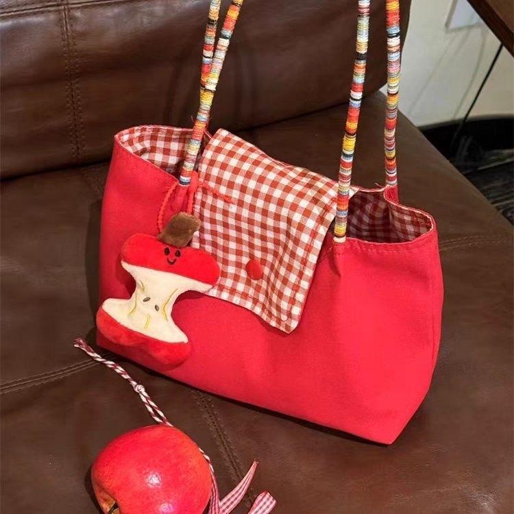 

Новая милая сумка красная на плечо портативная сумка для хранения 2025 новая сумка-тоут для поездок на работу повседневная универсальная high-quality canvas (apple pendant)