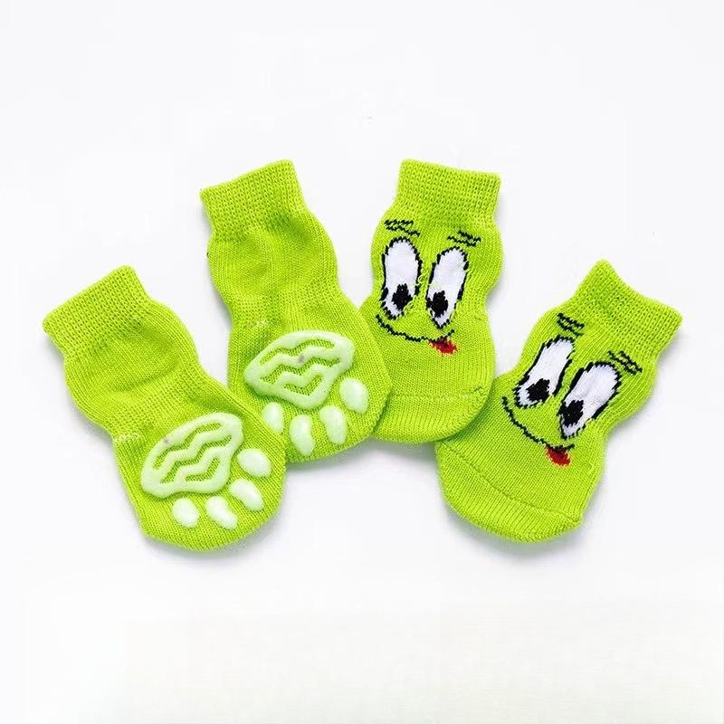 Four-pack of autumn/winter cartoon anti-slip socks for pets, including cat and dog warm socks with paw prints, perfect as a holiday gift.