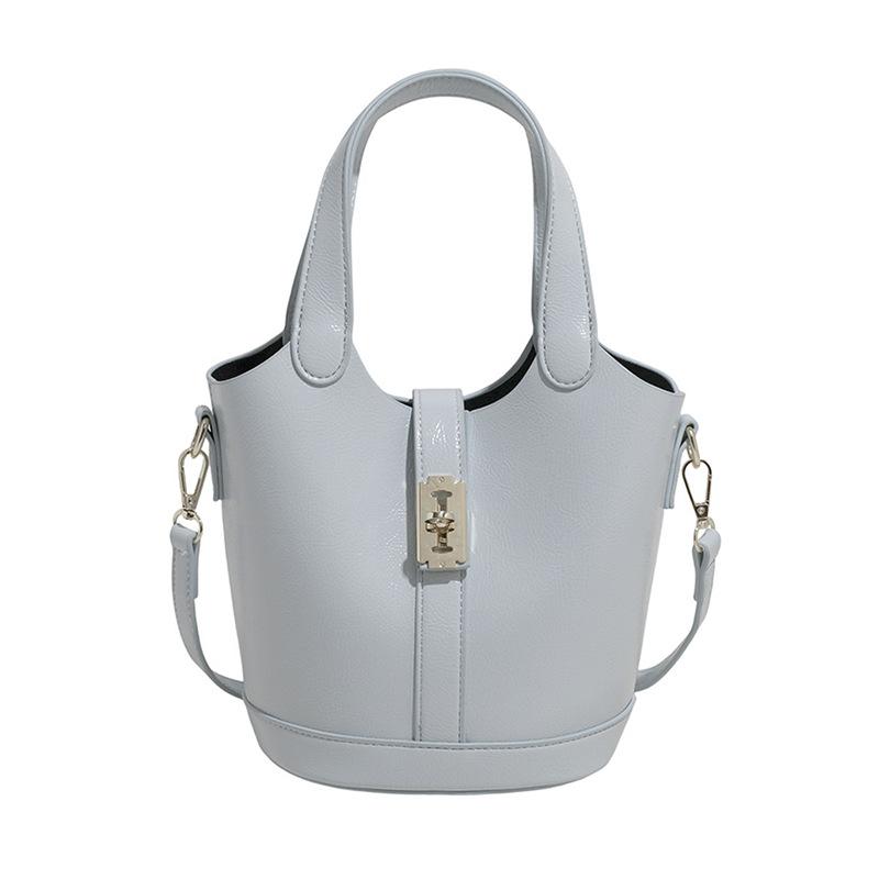 This Year's Popular Fashion Korean Version of Simple Solid Color Portable Bucket Bag Women's Casual Versatile Commuter Messenger Child and Mother Bag